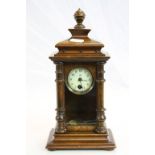 Small key wind Wooden cased Mantle clock with glazed front panel, pendulum & key, stands approx 25cm