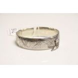 Hallmarked Silver Bangle type hinged bracelet with engraved Vine detailing