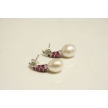 Pair of Silver earrings set with Ruby and Pearl