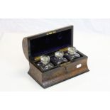 Small 19th Century dome top keyhole shape three bottle Tantalus box, velvet lined with original