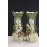 Pair of twin handled Royal Dux ceramic Vases, one with Man playing a Flute, the other with Female