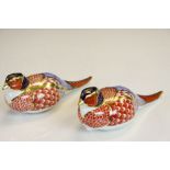 Pair of Royal Crown Derby Pheasant Paperweights, one numbered XLIX with no stopper, the other
