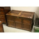 18th century Oak Panelled Coffer, the hinged lid opening to reveal a fitted candle box and with