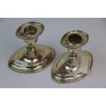 Pair of weighted Hallmarked Silver Candlesticks with original Sconce inserts, each approx 9cm tall