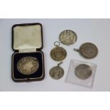 Small collection of Hallmarked Silver & white metal Medallions to include Boxed & an 1842 five