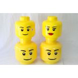 Four Lego storage heads