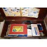 Wooden box containing vintage Meccano in good condition, featuring accessories, wheels and