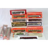 12 Boxed OO gauge items of rolling stock to include Hornby x 4, Lima x 3, Mainline x 1, Bachman x 1,