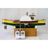 Scratch built wooden remote control boat "Sara", painted yellow, green, white and black on wooden