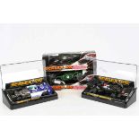 Four cased / boxed slot cars to include C129 March Ford, C126 Lotus 77, C118 Ford Escort with lights