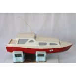 Wooden scratch built model boat with motor, painted red, black and white, approx. 29" in length