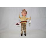 Schuco clockwork 983 tin Hula Girl with plastic face, cloth clothing, red hoop, vg condition w/ key