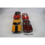 Four boxed Danbury Mint 1:24 diecast models to include 1964 Aston Martin DB5 (missing certificate),