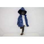 Original black Sasha doll in original raincoat and clothing, wearing one boot and one sandal, gd