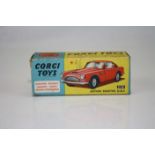 Boxed Corgi 218 Aston Martin DB4 diecast model in red with yellow interior, some paint loss, box gd