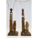 Pair of Folk Art carved Treen Table Lamps in the form of a Wood Cutter and his Family.