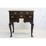 George I Antique Oak Lowboy having four drawers and a shaped apron, raised on four cabriole legs