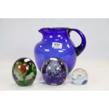 Murano millefiori paperweight and two others and a blue glass jug with pontil mark