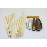 A collection of items to include four vintage penknives, an amber cheroot holder with hallmarked 9ct