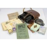 A box of mixed collectables to include binoculars, pewter hip flask, cigarette cards, stamps and