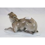 A Rosenthal recumbent porcelain whippet impressed Karner and no.80 to underside