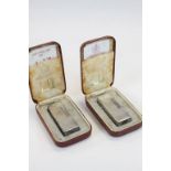 Two vintage Dunhill pocket lighters in original display boxes.