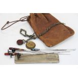 A small collection of items to include a hallmarked silver cased comb, a selection of hat pins and