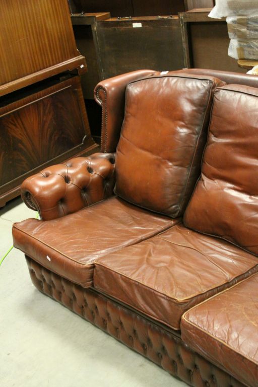 A brown leather three seater chesterfield style sofa. - Image 3 of 4