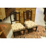 Pair of Victorian low chairs raised on turned legs with casters