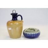 A Doulton stoneware jug with stopper and a Doulton ashtray impressed 20201 artist M J.