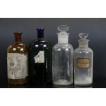 A collection of four vintage Apothecary chemists bottles.