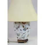 A chinese ceramic lamp base with butterfly decoration, measures approx 30cm in height excluding