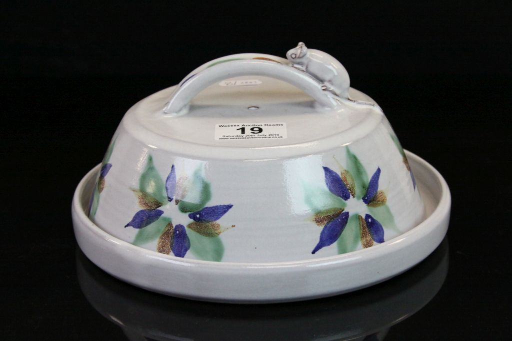 A Cornish studio pottery cheese dish by Tregurnow with floral and mouse decoration