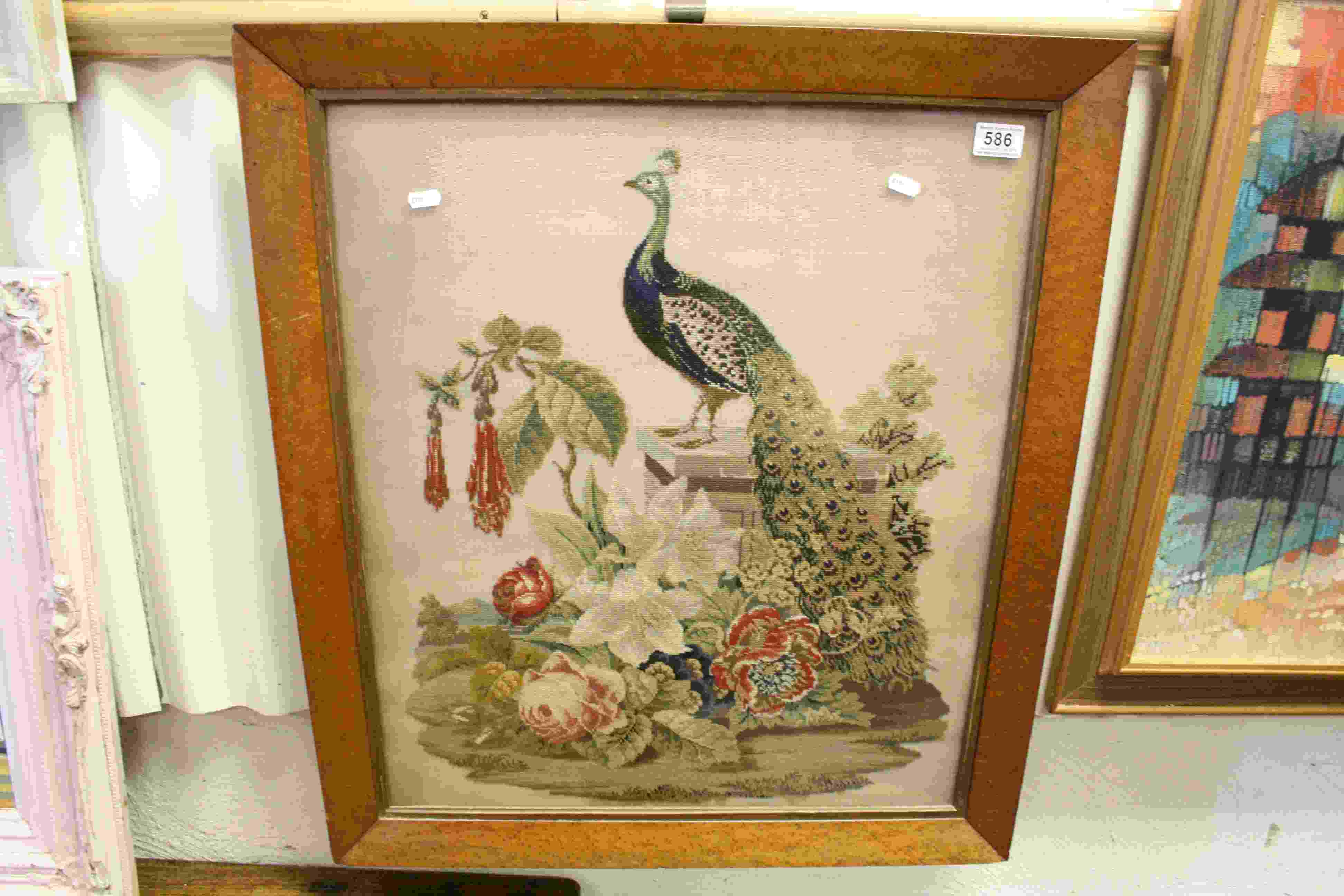 Framed and glazed tapestry of a peacock within floral scene approx. 77cm x 68cm