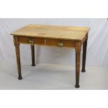 Early to Mid 20th century Oak Desk, the two drawers with brass cup handles and raised on turned