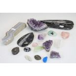 A collection of various rocks and crystals to include amethyst and rose quartz.