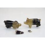 Two carved Derbyshire Blue John pigs.