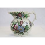 A mid 19th century Staffordshire floral decorated jug inscribed Jame Smith Born December 26th 1854.
