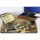 A box containing a quantity of silver plated cutlery.