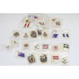 A collection of approx 50 Cigarette silks to include flags and military examples.