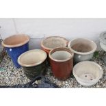 Six ceramic flower pots, various sizes