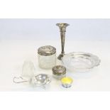 A small collection of hallmarked silver items to include a bud vase, various dressing table jars,