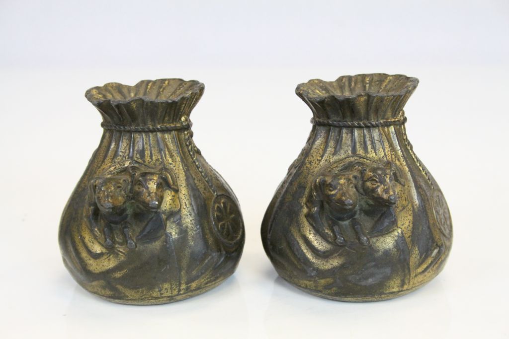 Pair of Edwardian Gilt finish Spelter lucky cash bag Money boxes each with a pair of Dachshunds