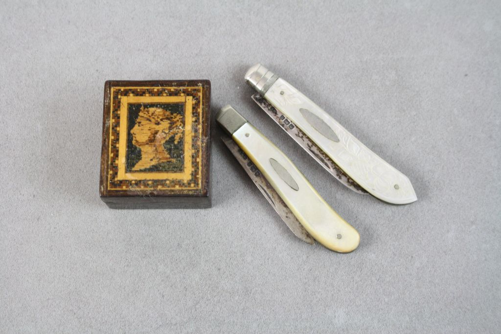 Two silver bladed fruit knives with mother of pearl handles and a Tunbridgeware stamp box.