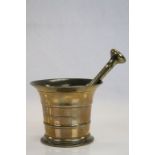 Antique bronze pestle and mortar.