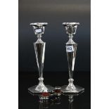 A pair of silver plated candlesticks measuring approx 11" in height together with a pair of opera