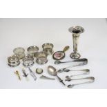 A quantity of hallmarked silver items to include napkin rings, vase & cutlery together with a