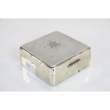 A hallmarked silver cigarette box with a makers mark for Aide Brothers and a Birmingham assay mark.