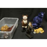A collection of wooden and ceramic Cat ornaments.