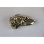 White metal Vesta, modelled as a Dog's head with Garnet eyes, approx 5cm long in total